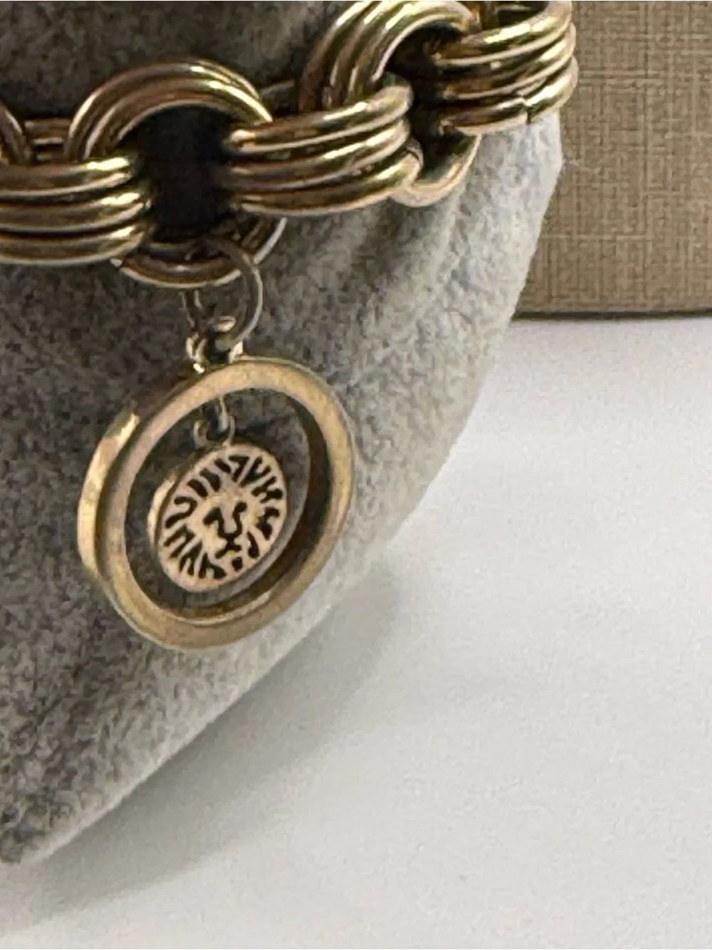 Anne Klein Gold Charm Bracelet Watch with Mother-of-Pearl Dial & Bow Charm